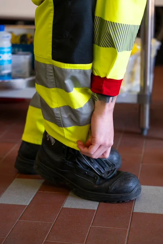 Person binding his shoelaces.